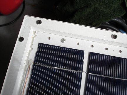 Installing the half panels into the full solar panel