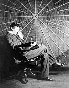 Tesla sitting next to a high-frequency electric coil
